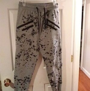 Gray joggers with black paint splats